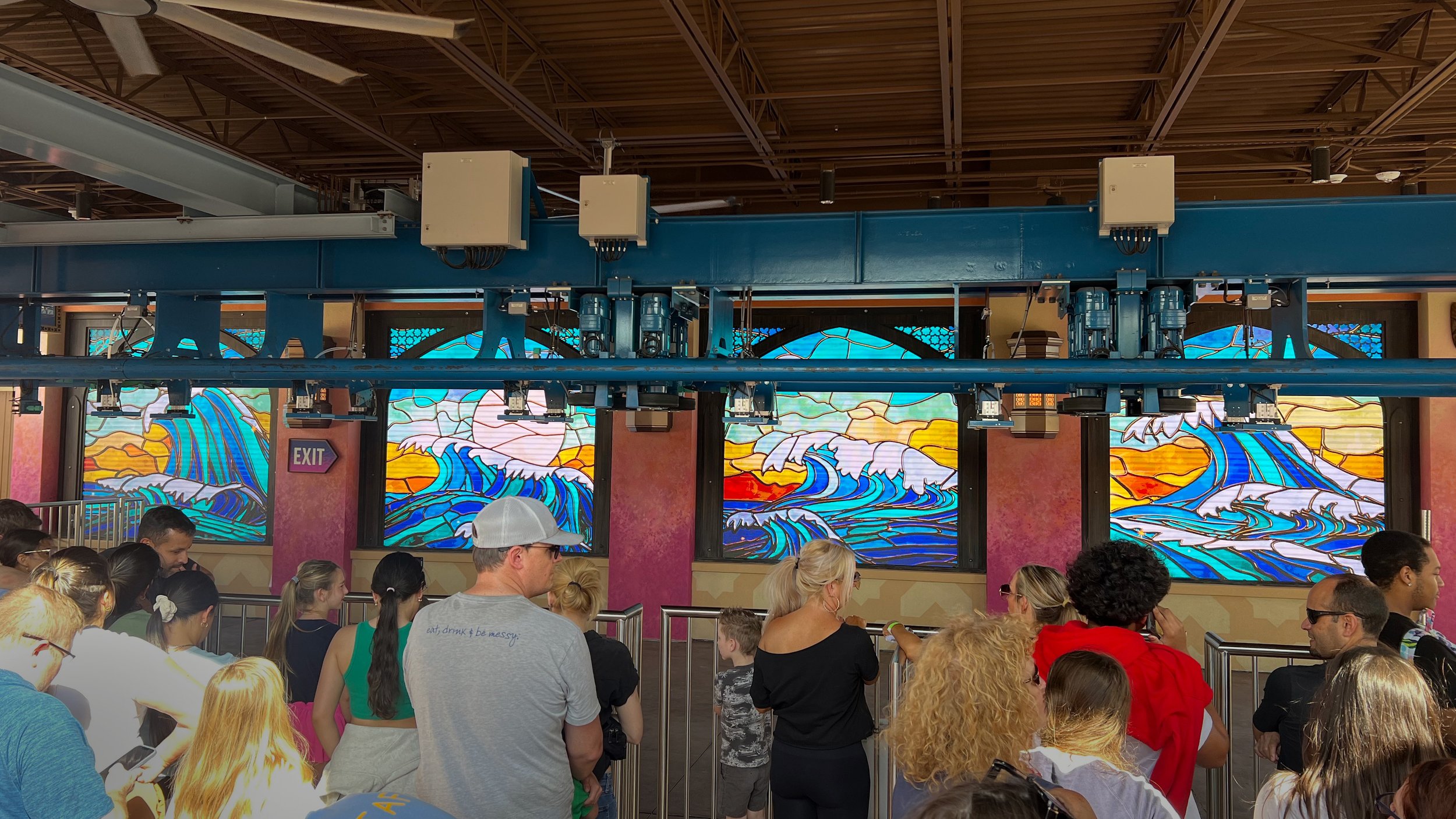 Guests in the queue viewing the sea phoenix's wave stained-glass windows